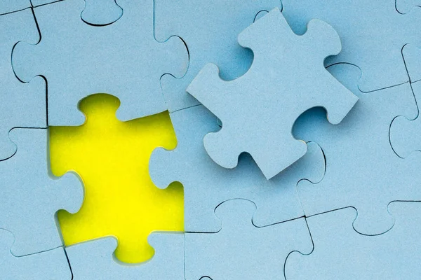 Completing Final Task Missing Blue Jigsaw Puzzle Piece Yellow Background — Stock Photo, Image