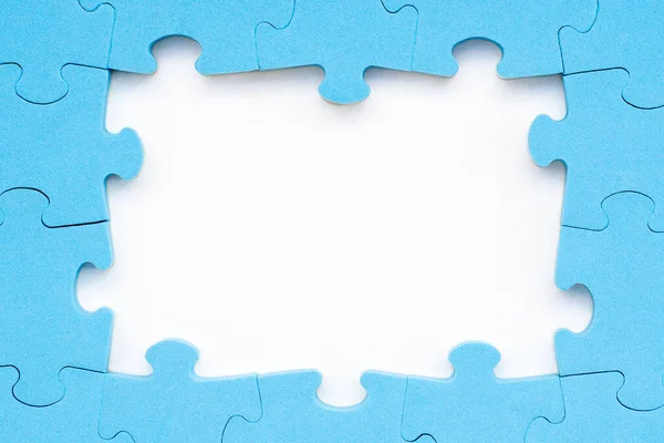 Rámeček Modré Puzzle Bílém Pozadí Pro Váš Text — Stock fotografie