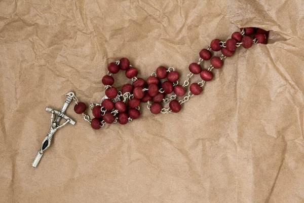 Catholic Rosary Coming Out Hole Paper — Stock Photo, Image