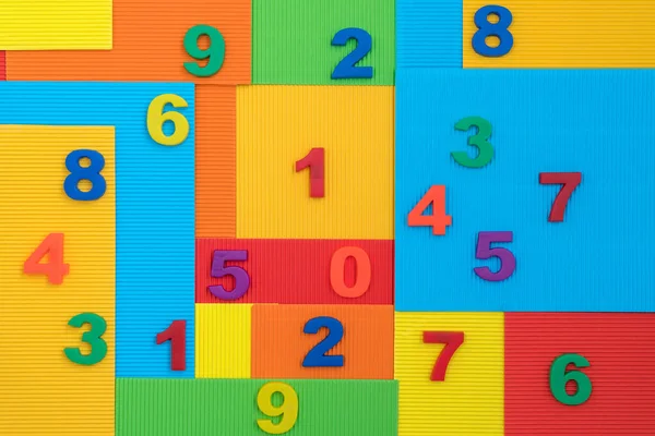 Plastic Numbers Vibrant Colorful Paper Background — Stock Photo, Image