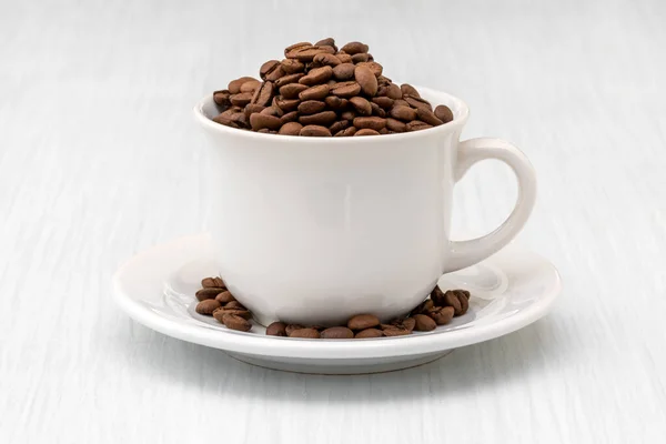 Cup Full Coffee Beans White Wooden Table — Stock Photo, Image