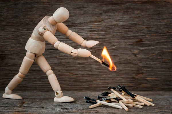 Wooden Man Ignites Bonfire Matches Wooden Background Unsafe Behaviour Dangerous — Stock Photo, Image