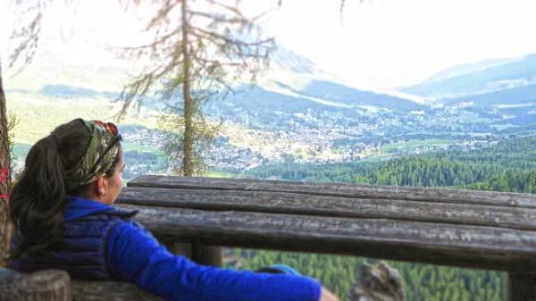 Female hiker staring at the beautiful landscape of Cortina D\'empezzo in Italy