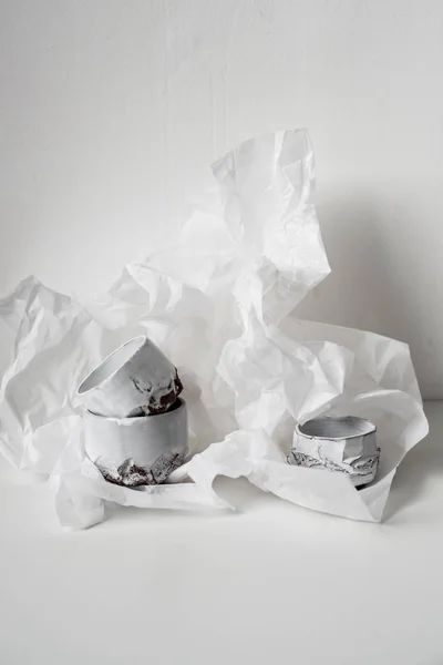 Handmade ceramic vase on dented white paper — Stock Photo, Image