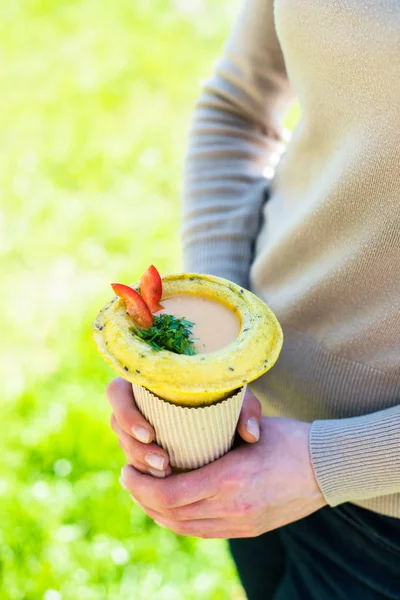 Woman holding healthy vegan street food in her hands — Stock Photo, Image