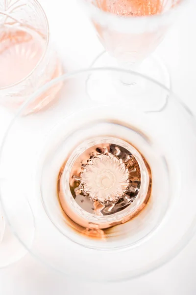 Sparkling rose wine in different glasses on white background — Stock Photo, Image