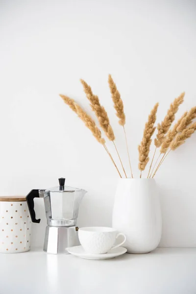 White home decor, coffee maker, ceramic vase and cup on tabletop, contemporary interior