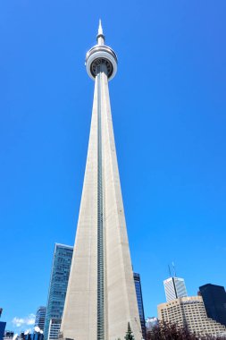 TORONTO, CANADA - JULY 15, 2018: Scenic view of CN Tower in Toronto, Ontario, Canada. CN Tower is the world's 9th tallest free-standing structure, and observation tower located in Downtown Toronto. clipart