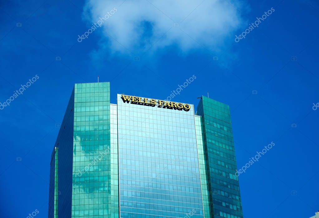 MIAMI, USA - AUGUST 22, 2018: Wells Fargo skyscraper and logo in Miami, Florida. Wells Fargo is an American multinational financial services company