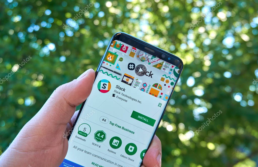MONTREAL, CANADA - August 28, 2018: Slack android app on Samsung s8 screen in a hand.