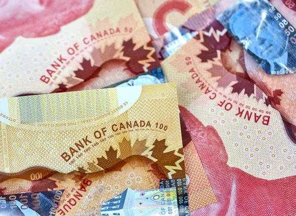 canadian money in a pocket of a blue jeans