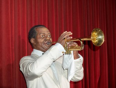 MONTREAL, CANADA - SEPTEMBER 23, 2018: Louis Daniel Armstrong, American trumpeter, composer, vocalist and occasional actor. Wax museum Grevin in Montreal, Quebec, Canada clipart