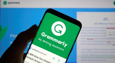 MONTREAL, CANADA - OCTOBER 4, 2018: Grammarly check logo and app on a Samsung s8 screen. Grammarly is a popular English-language writing-enhancement software developed by Grammarly Inc. clipart
