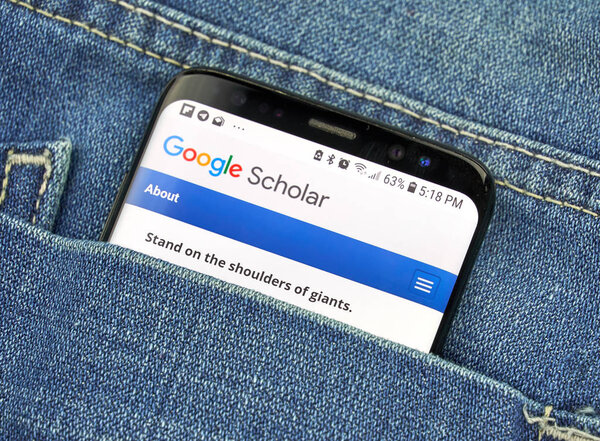 MONTREAL, CANADA - OCTOBER 4, 2018: Google Scholar on s8 screen. Google Scholar is an online service allowing users to search across variaty of academic literature, developed by Google