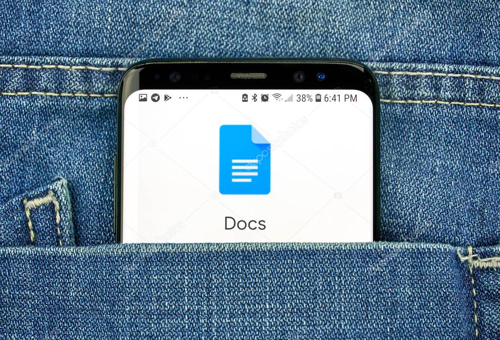 MONTREAL, CANADA - OCTOBER 4, 2018: Google Docs app on s8 screen in a pocket of a blue jeans. Google is an American technology company which provides a variety of internet services.