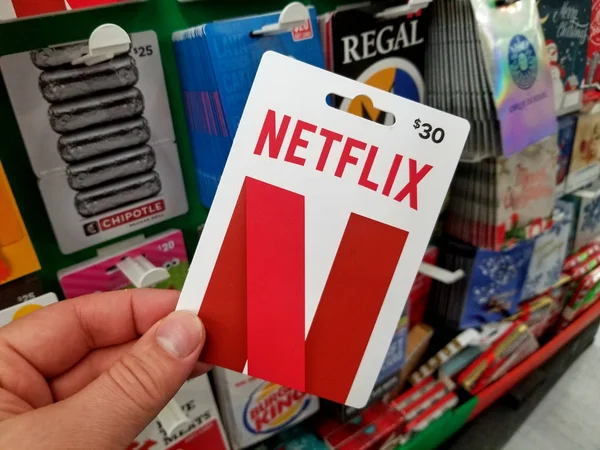 Netflix gift card in a hand — Stock Photo, Image