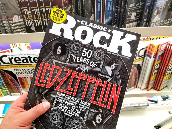 Classic Rock magazine in a hand — Stock Photo, Image