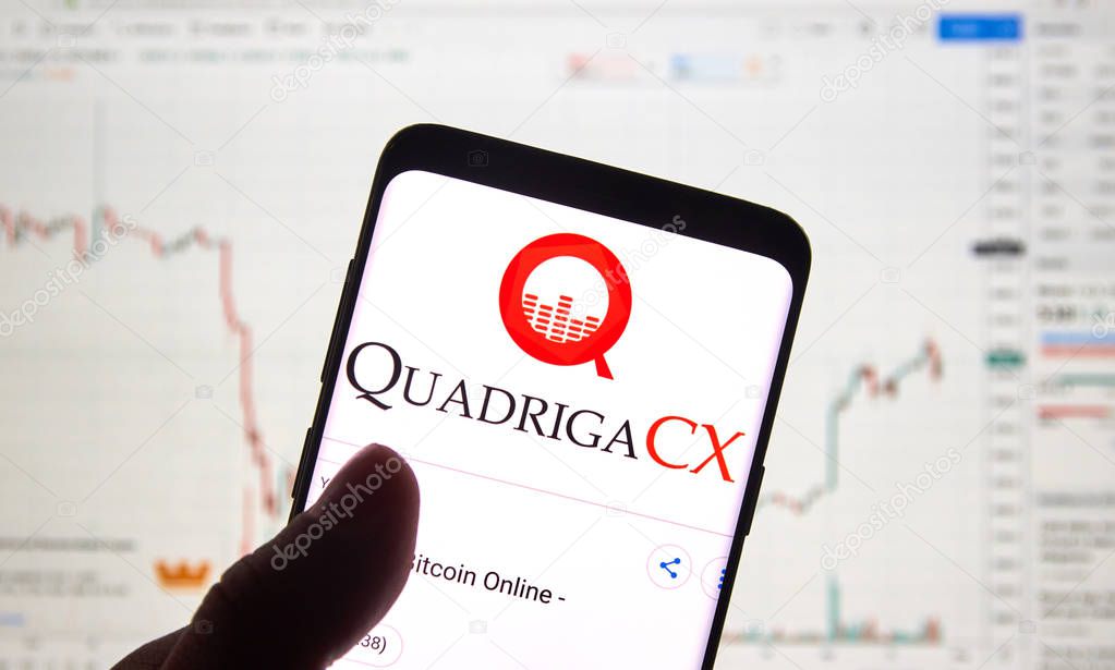 MONTREAL, CANADA - APRIL 26, 2019: QuadrigaCX cryptocurrency exchange logo and application on Android Samsung Galaxy s9 Plus screen in a hand over a laptop display with bitcoin chart on it.