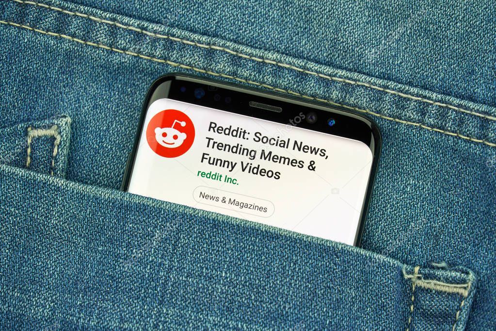 MONTREAL, CANADA - December 23, 2018: Reddit logo and android app on Samsung s8 screen in a blue jeans pocket. Reddit is an American social news aggregation and discussion website