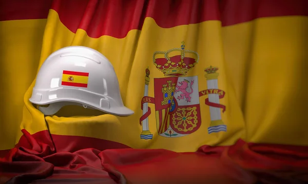 White hard hat laying over spanish  flag. Construction and emplo — Stock Photo, Image