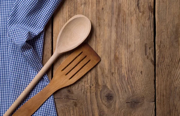wooden spoon and spatula  on wooden background.