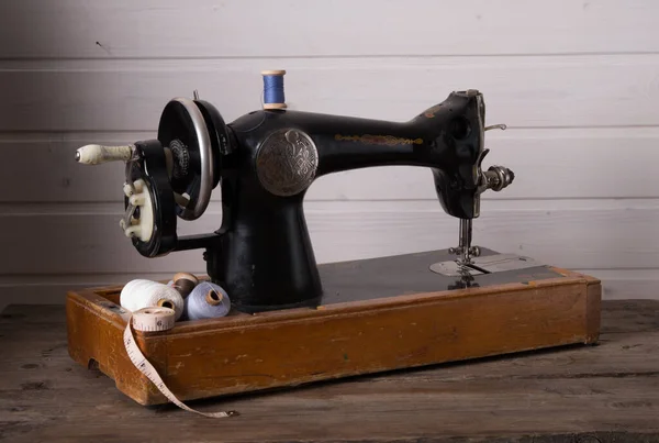 Old sewing machine, fabric and sewing thread.