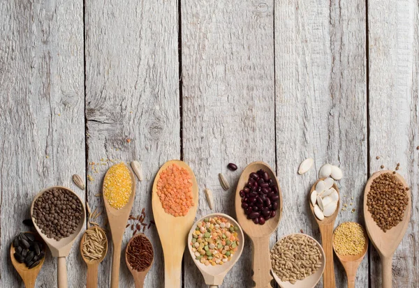 Cereals on wooden background — Stock Photo, Image