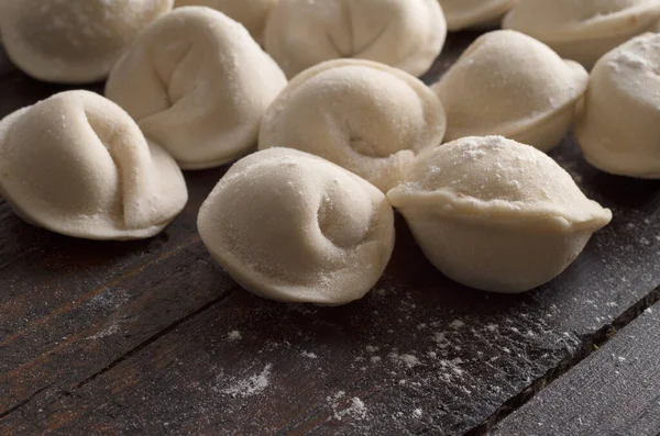 Dumplings in flour on the table — Stock Photo, Image
