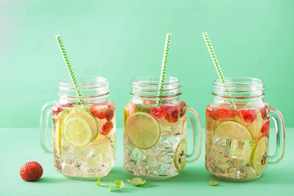 refreshing summer lemonade with strawberry and lime in mason jar