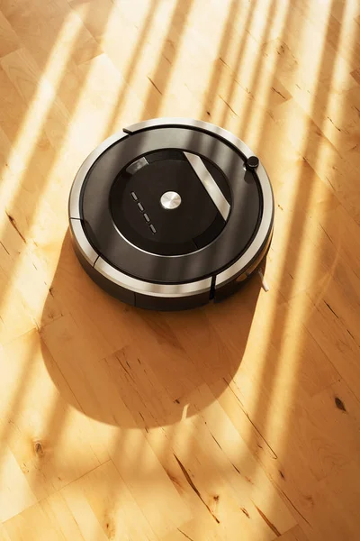 robotic vacuum cleaner on laminate wood floor smart cleaning technology