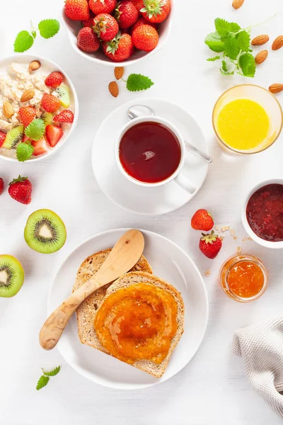 Healthy Breakfast Oatmeal Porridge Strawberry Nuts Toast Jam Tea Top — Stock Photo, Image