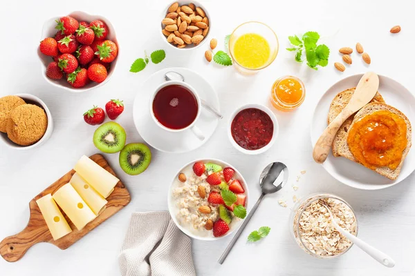 Healthy Breakfast Oatmeal Porridge Strawberry Nuts Toast Jam Tea Top — Stock Photo, Image