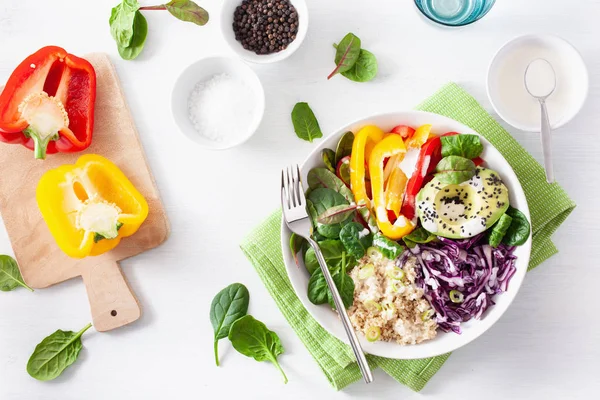 veggie couscous lunch bowl with avocado, bell peppers, spinach a