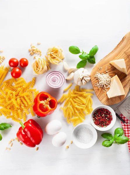 Ingredients for italian cousine flat lay, pasta spaghetti penne — Stock Photo, Image