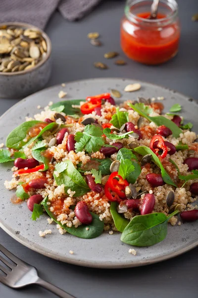 healthy bean and quinoa salad with spinach, chili