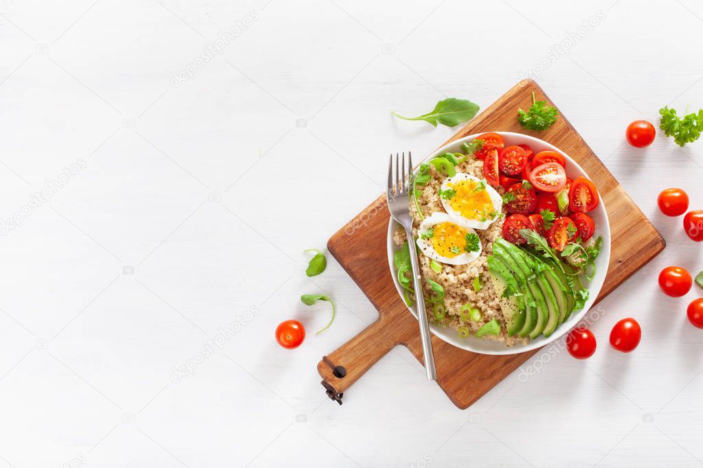 quinoa with boiled egg, avocado, tomato, arugula. healthy breakf