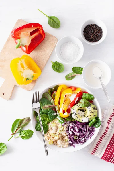 veggie couscous lunch bowl with avocado, bell peppers, spinach a