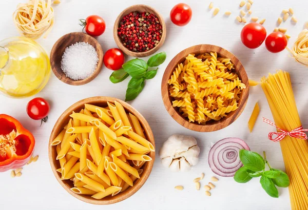 Ingredients for italian cousine flat lay, pasta spaghetti penne — Stock Photo, Image