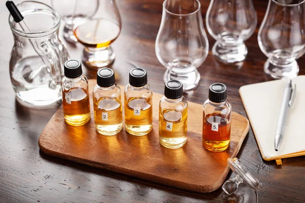 stock image tasting bottles and glasses of whisky spirit brandy cognac. tasting at home