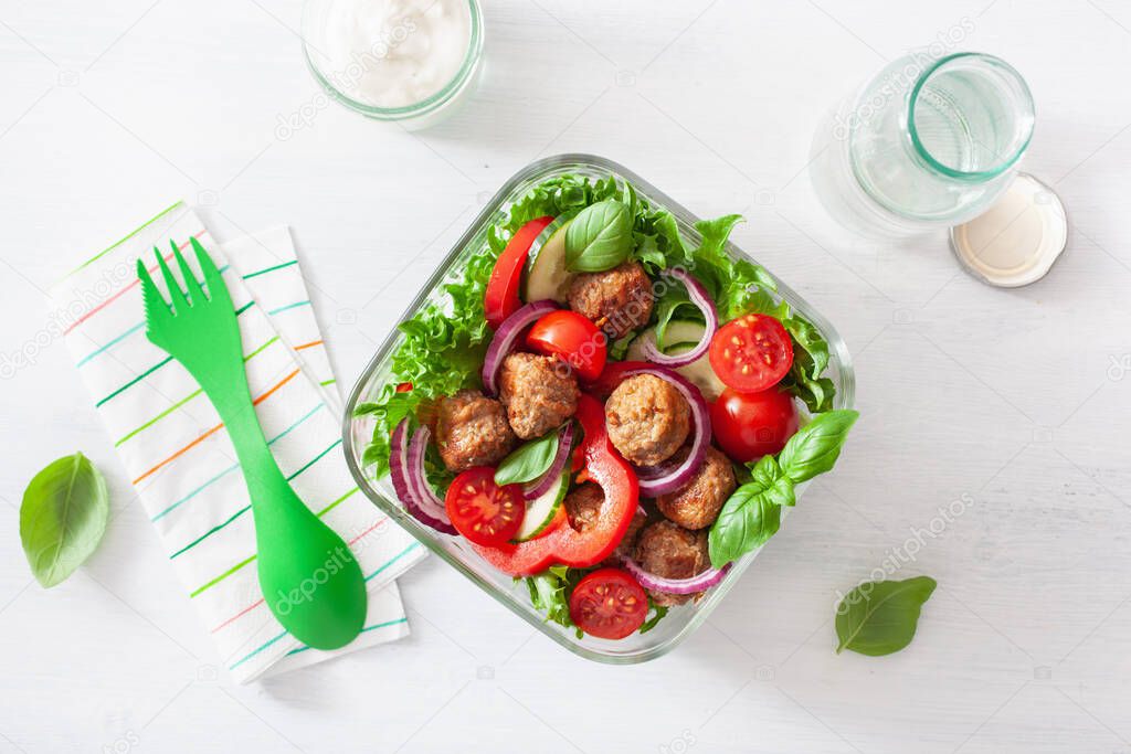 keto paleo lunch box with meatballs, lettuce, tomato, cucumber, bell pepper