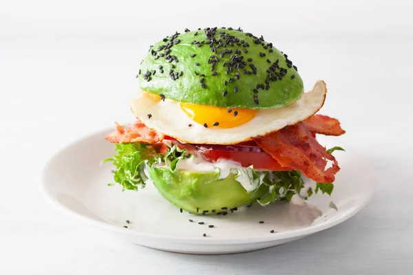 stock image keto paleo diet avocado breakfast burger with bacon, egg, tomato