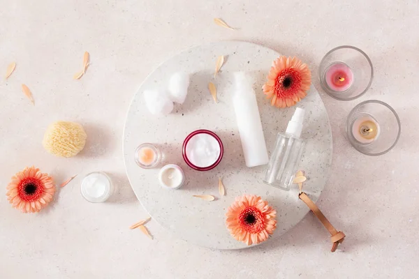 skincare products and daisy flowers. natural cosmetics for home spa treatment