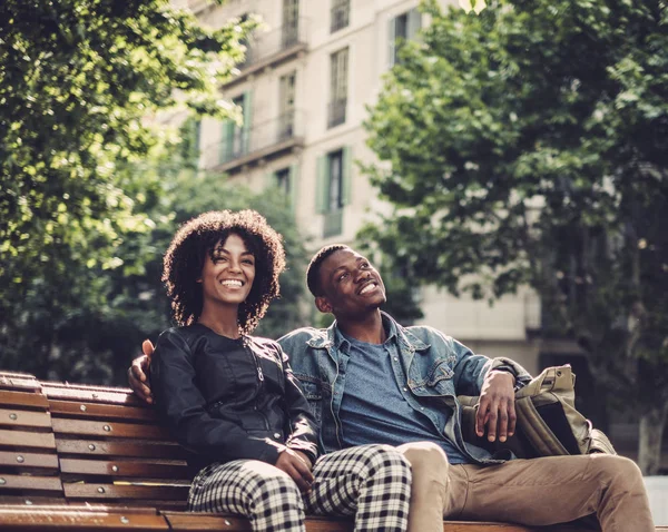 Young happy black couple outdoors