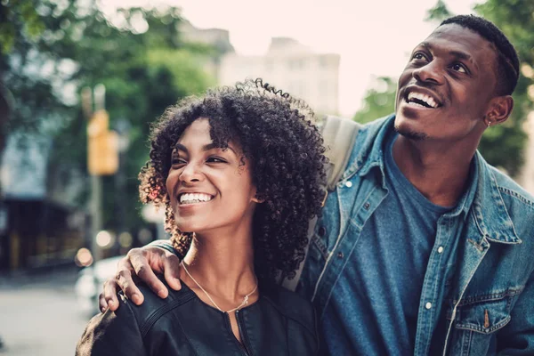 Young happy black couple outdoors