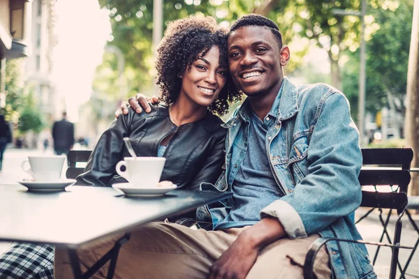 Young happy black couple in a park