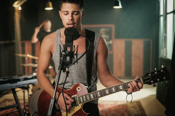 Music band having rehearsal in a studio — Stock Photo, Image