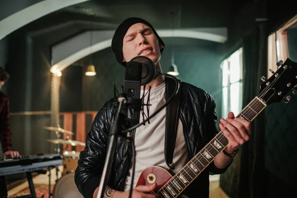 Music band having rehearsal in a studio — Stock Photo, Image