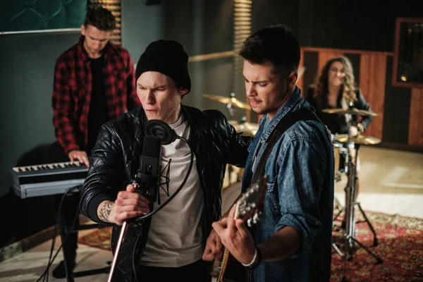 Music band having rehearsal in a studio — Stock Photo, Image