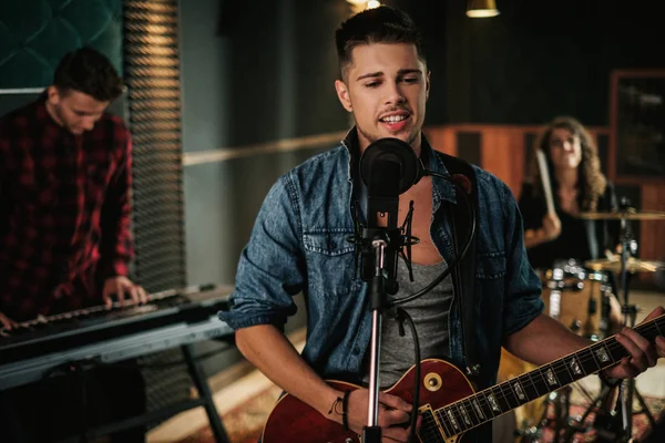 Music band having rehearsal in a studio — Stock Photo, Image