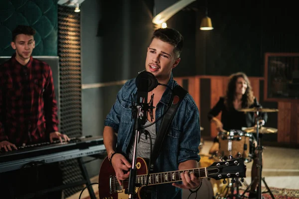 Music band having rehearsal in a studio — Stock Photo, Image